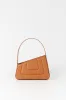Tobacco asymmetric leather quilted mini bag sold by DESTREE