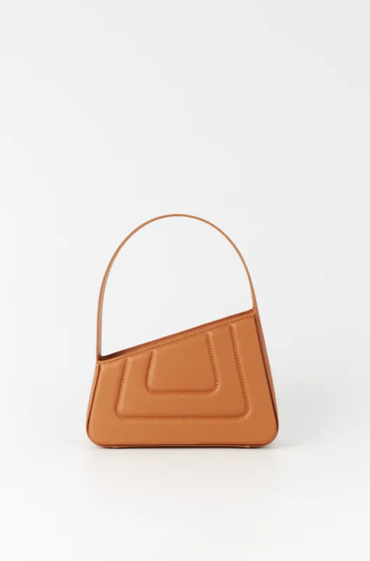 Tobacco asymmetric leather quilted mini bag sold by DESTREE