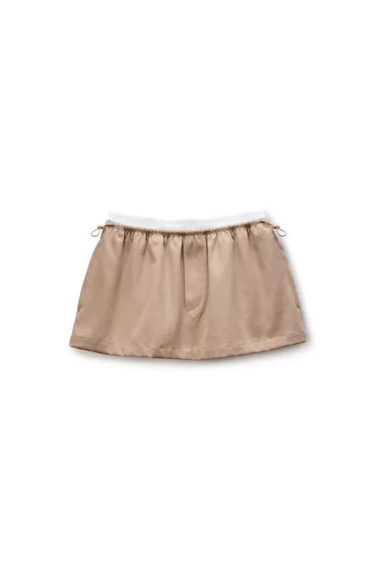 Mid-Rise Mini Logo Elastic Skirt (Warm Taupe) sold by TONS