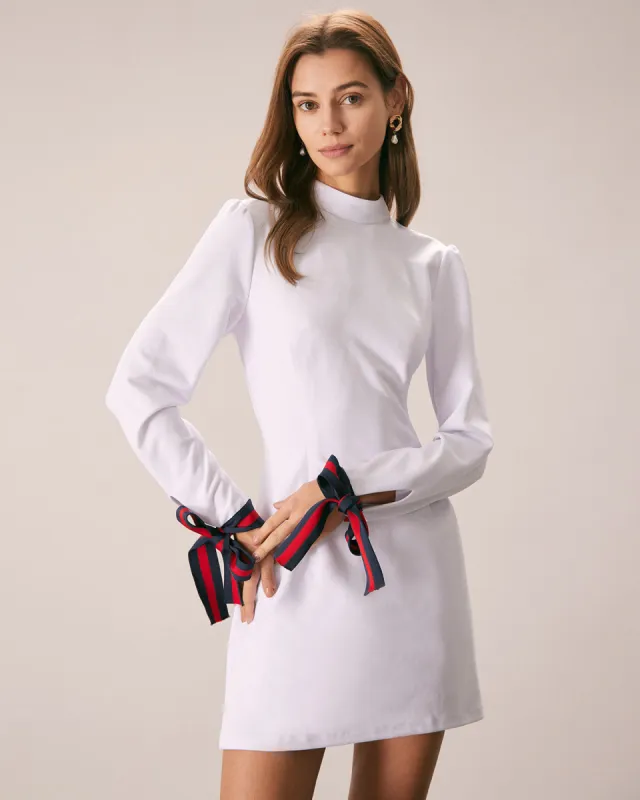 The White Mock Neck Bowknot Cuff Mini Dress sold by rihoas
