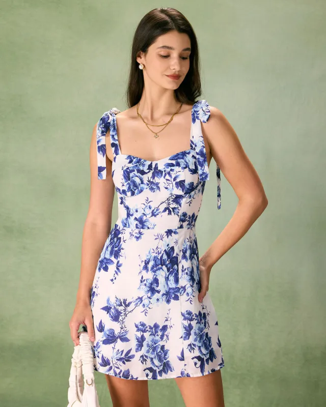 The Blue Floral Tie Strap Mini Dress sold by rihoas