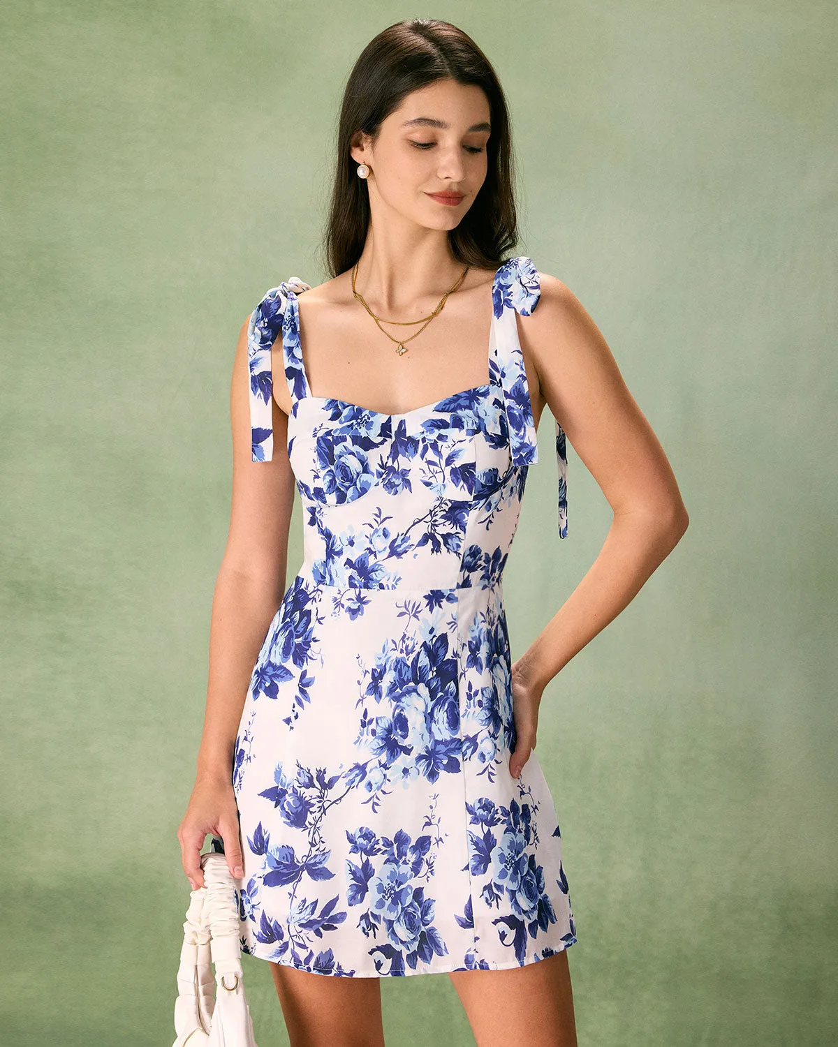 The Blue Floral Tie Strap Mini Dress sold by rihoas