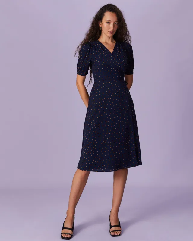The Navy V Neck Polka Dot Wrap Midi Dress sold by rihoas