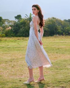 The Beige Floral Ruched Slip Midi Dress sold by rihoas