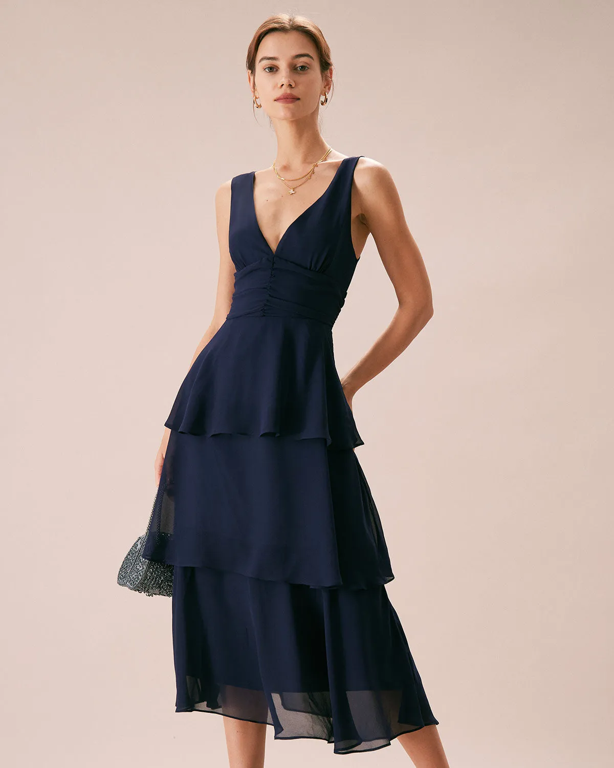 The Navy V Neck Ruffle Layered Midi Dress sold by rihoas