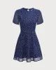 The Navy Crew Neck Polka Dot Cutout Mini Dress sold by rihoas