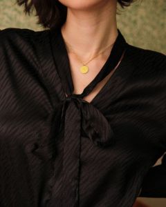 The Solid V Neck Knotted Blouse sold by rihoas
