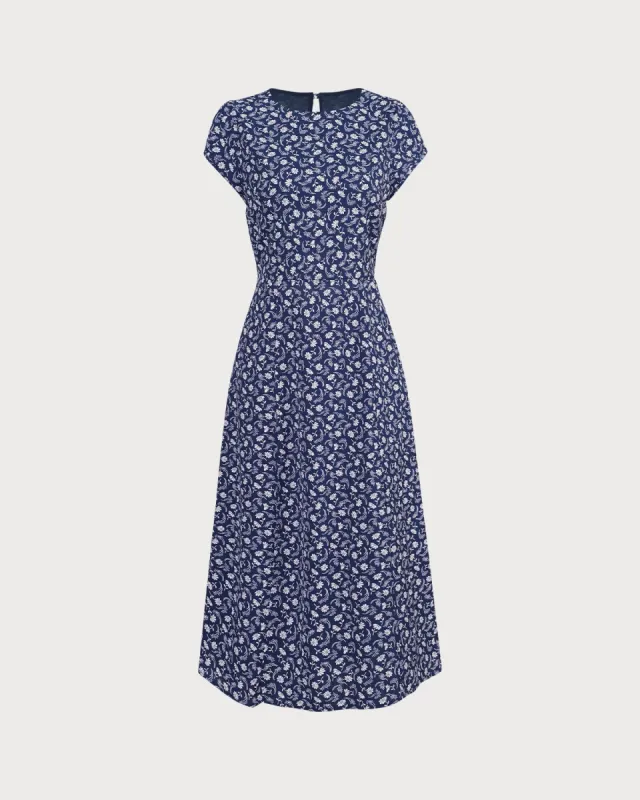 The Navy Floral Cutout Cap Sleeve Midi Dress sold by rihoas