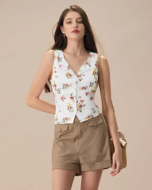 The White V Neck Floral Button Sleeveless Shirt sold by rihoas