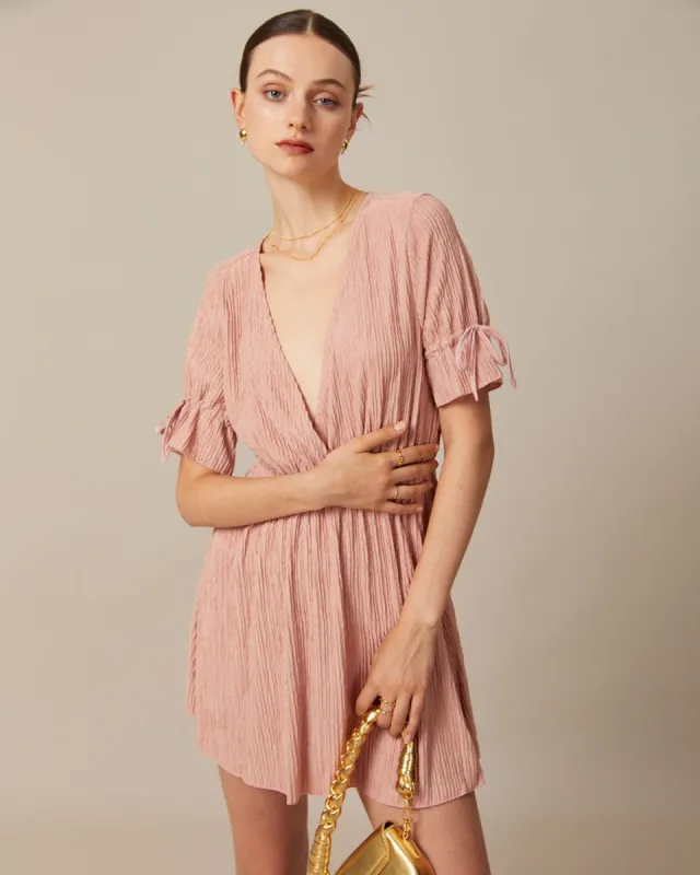 The Pink V Neck Textured Pleated Mini Dress sold by rihoas