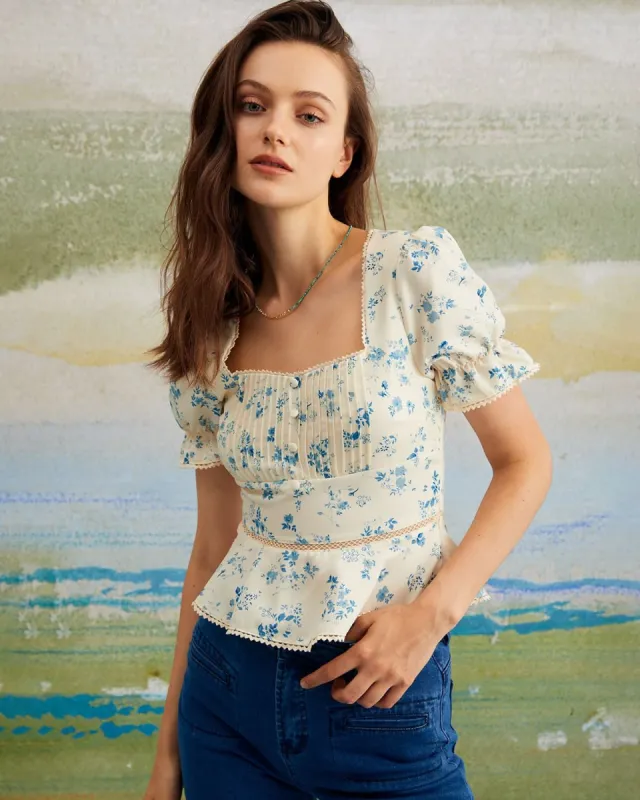The Blue Floral Pleated Puff Sleeve Blouse sold by rihoas