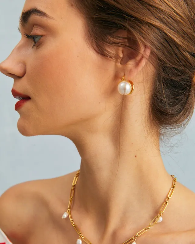 The Gold Symmetrical Pearl Stud Earrings sold by rihoas