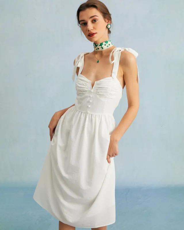 The White Tie Shoulder Notched Button Midi Dress sold by rihoas