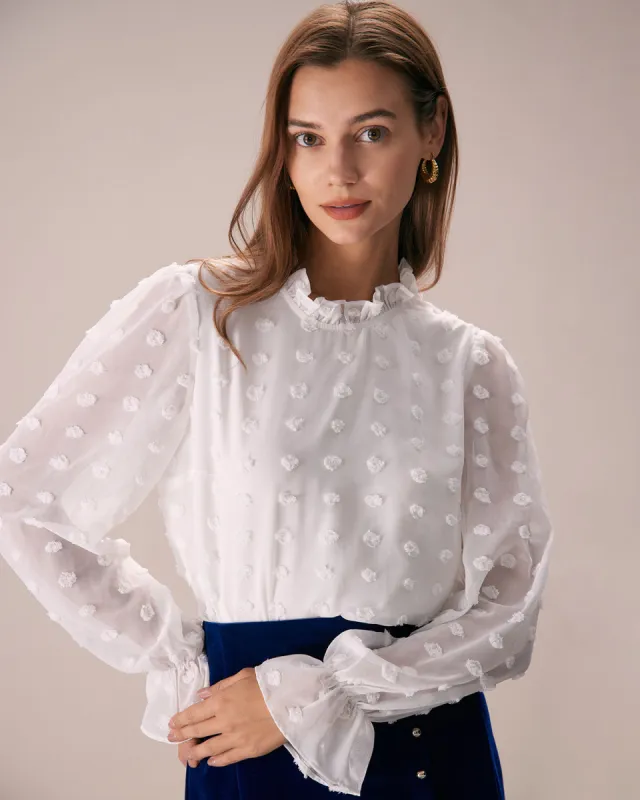The White Mock Neck Dobby Sheer Blouse sold by rihoas