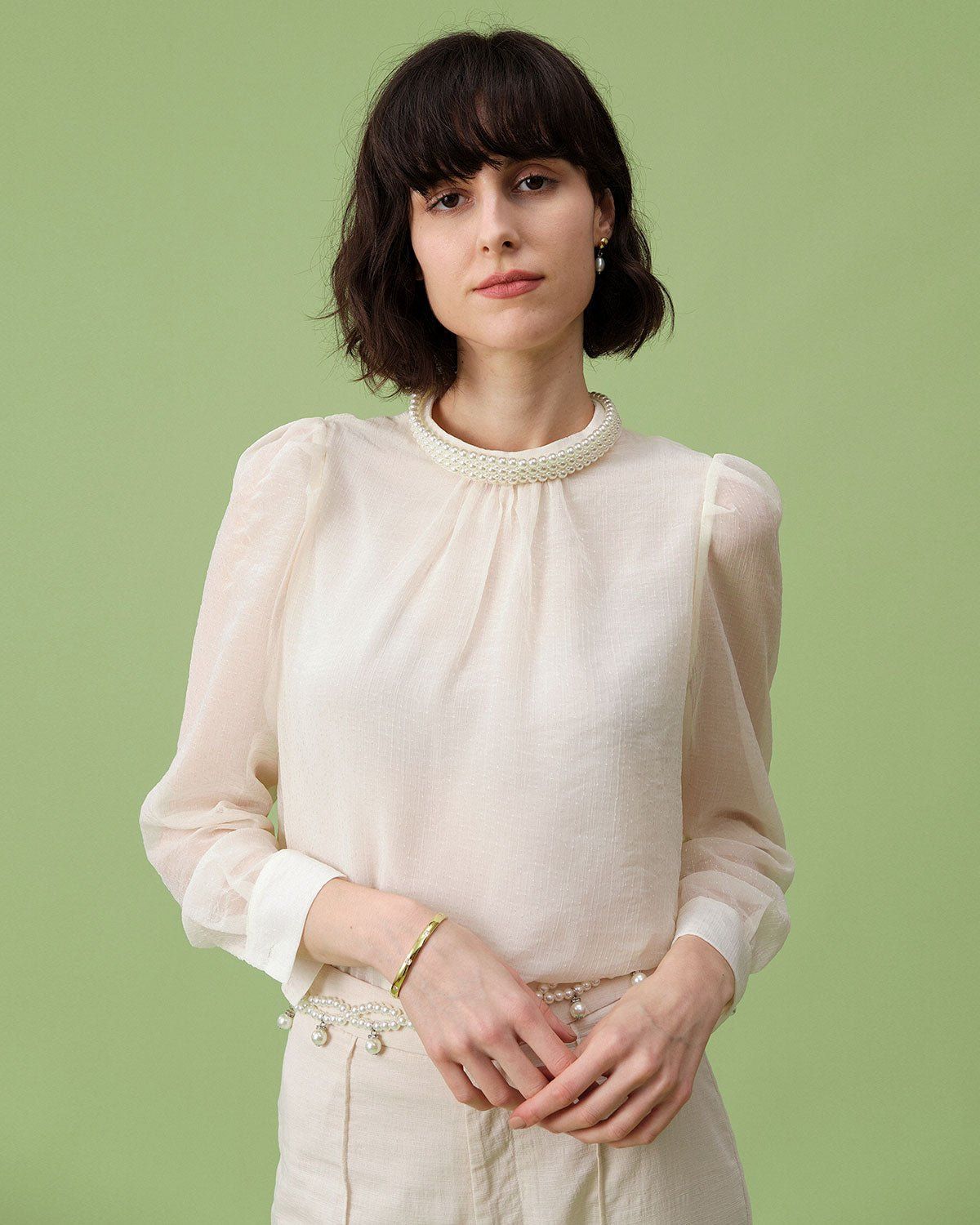 The Beige Mock Neck Sheer Sleeve Blouse sold by rihoas