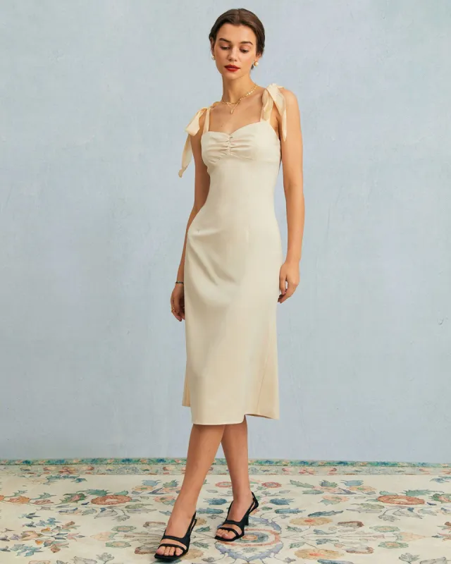 The Beige Tie Shoulder Ruched Slip Midi Dress sold by rihoas