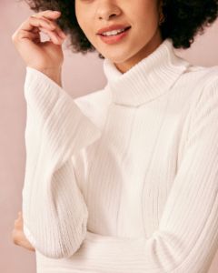 The White Turtleneck Flare Sleeve Knit Top sold by rihoas
