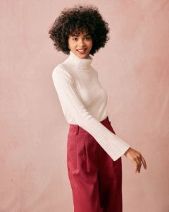The White Turtleneck Flare Sleeve Knit Top sold by rihoas