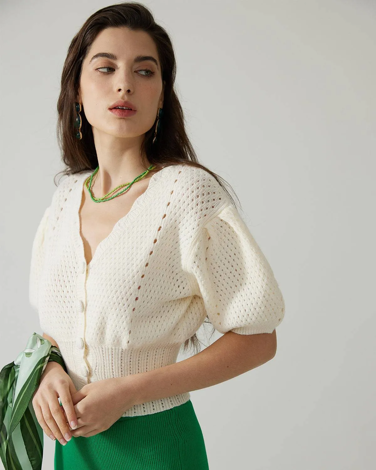 The Short-Sleeve Cutout Knitted Top sold by rihoas