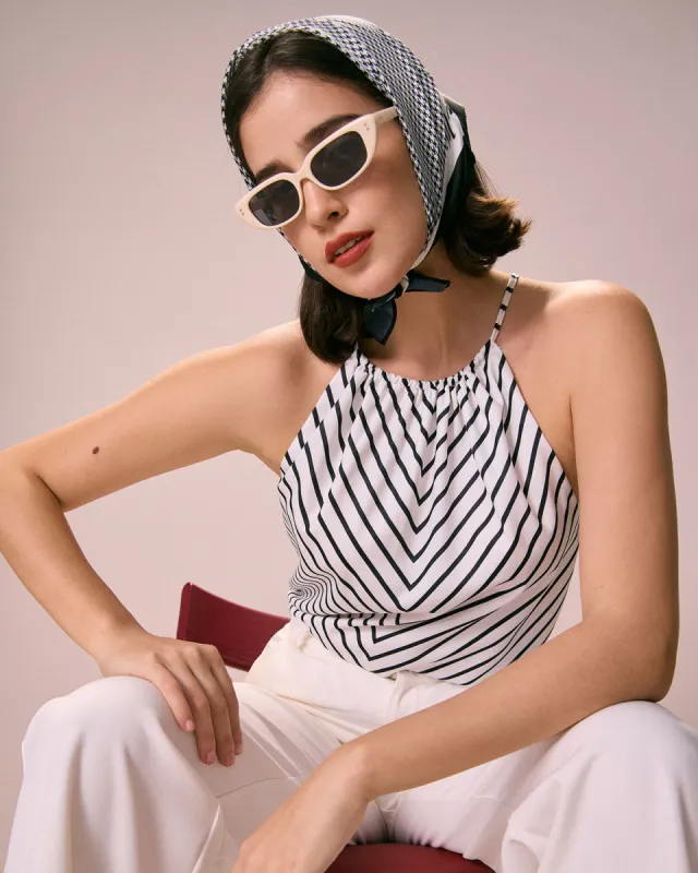 The Black Ruched Striped Halter Top sold by rihoas
