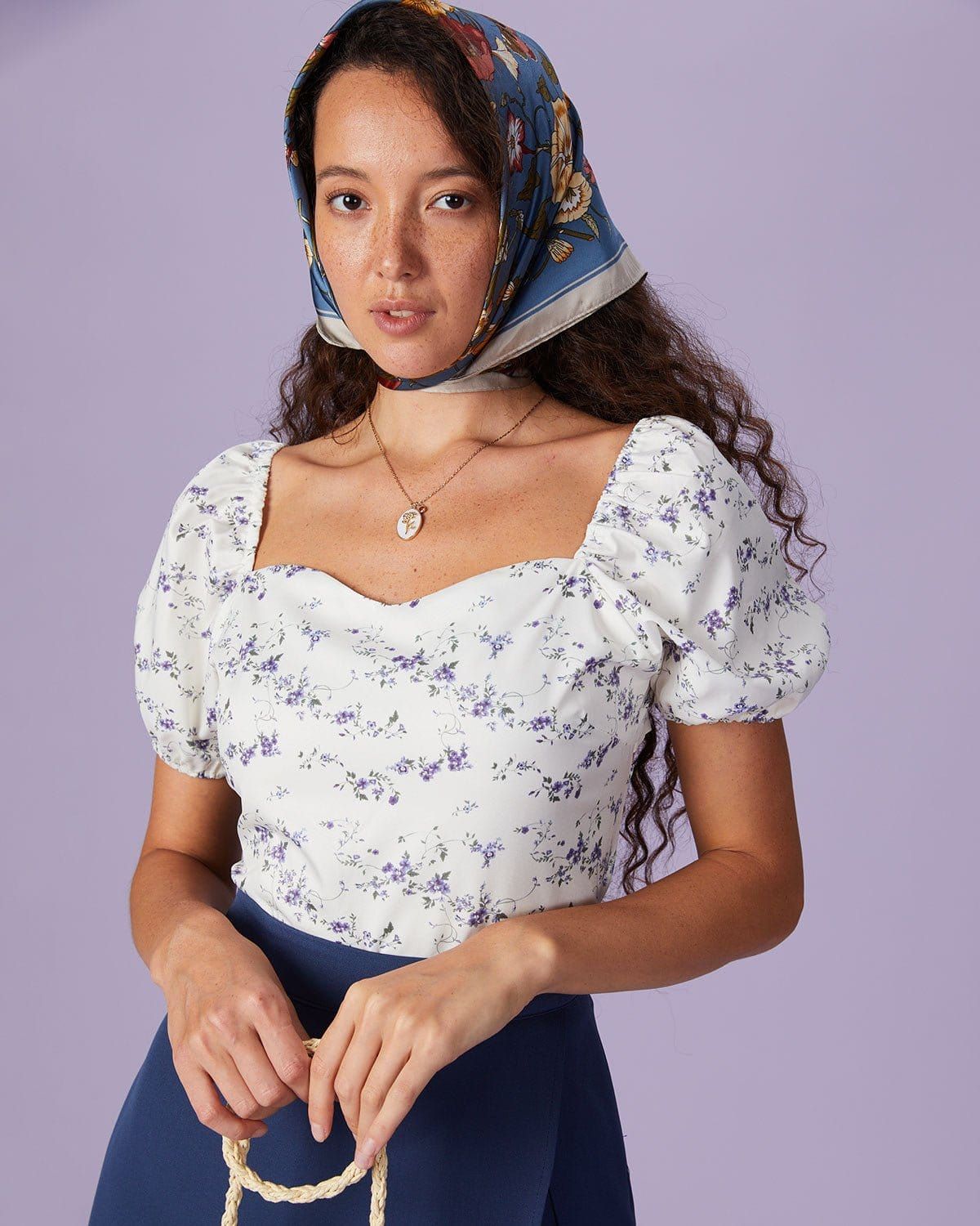 The White Sweetheart Neck Floral Cutout Blouse sold by rihoas