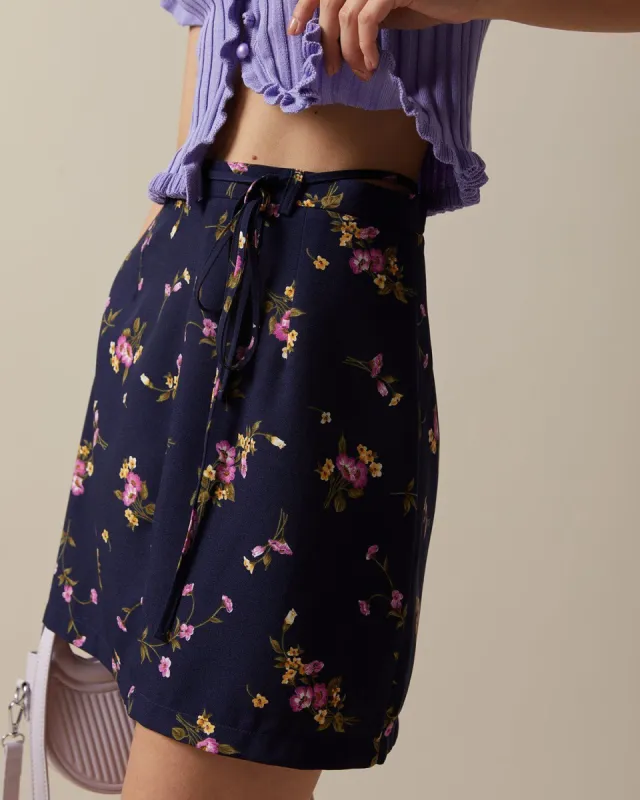 The Navy High Waisted Tie Floral Mini Skirt sold by rihoas