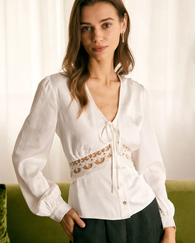 The White V Neck Lace Button Up Blouse sold by rihoas