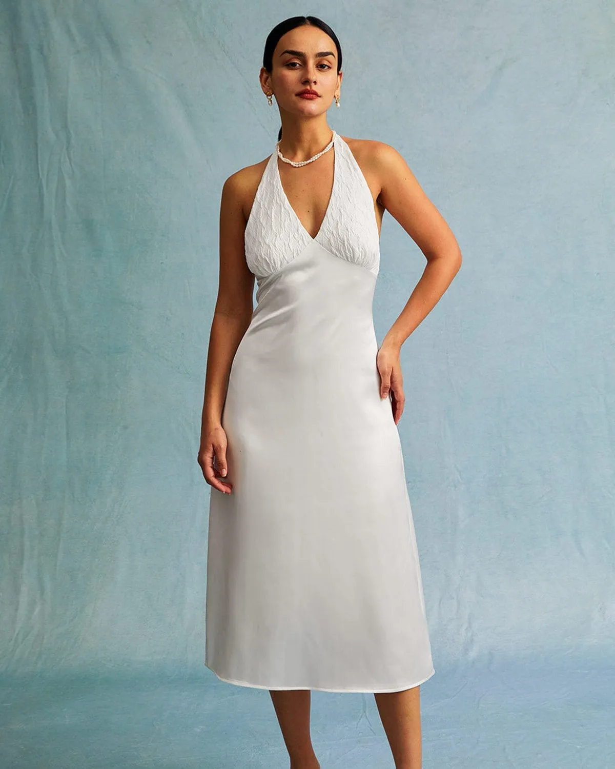 The White Halter Spliced Ruched Satin Midi Dress sold by rihoas