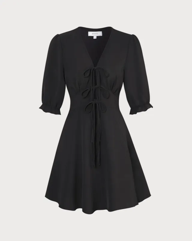 The Black V Neck Puff Sleeve Ruffle Mini Dress sold by rihoas