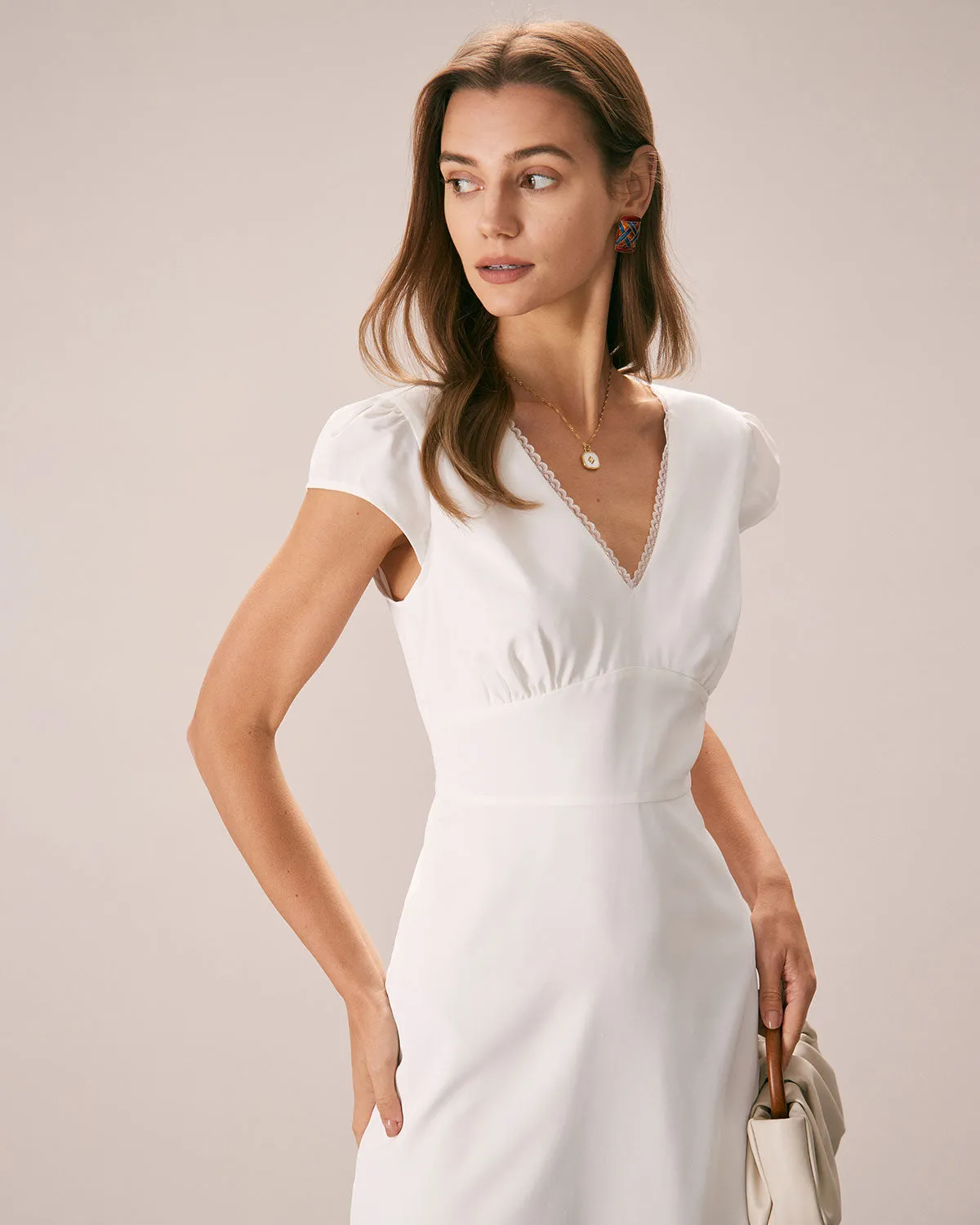 The White V Neck Lace Cap Sleeve Midi Dress sold by rihoas product image thumbnail 2