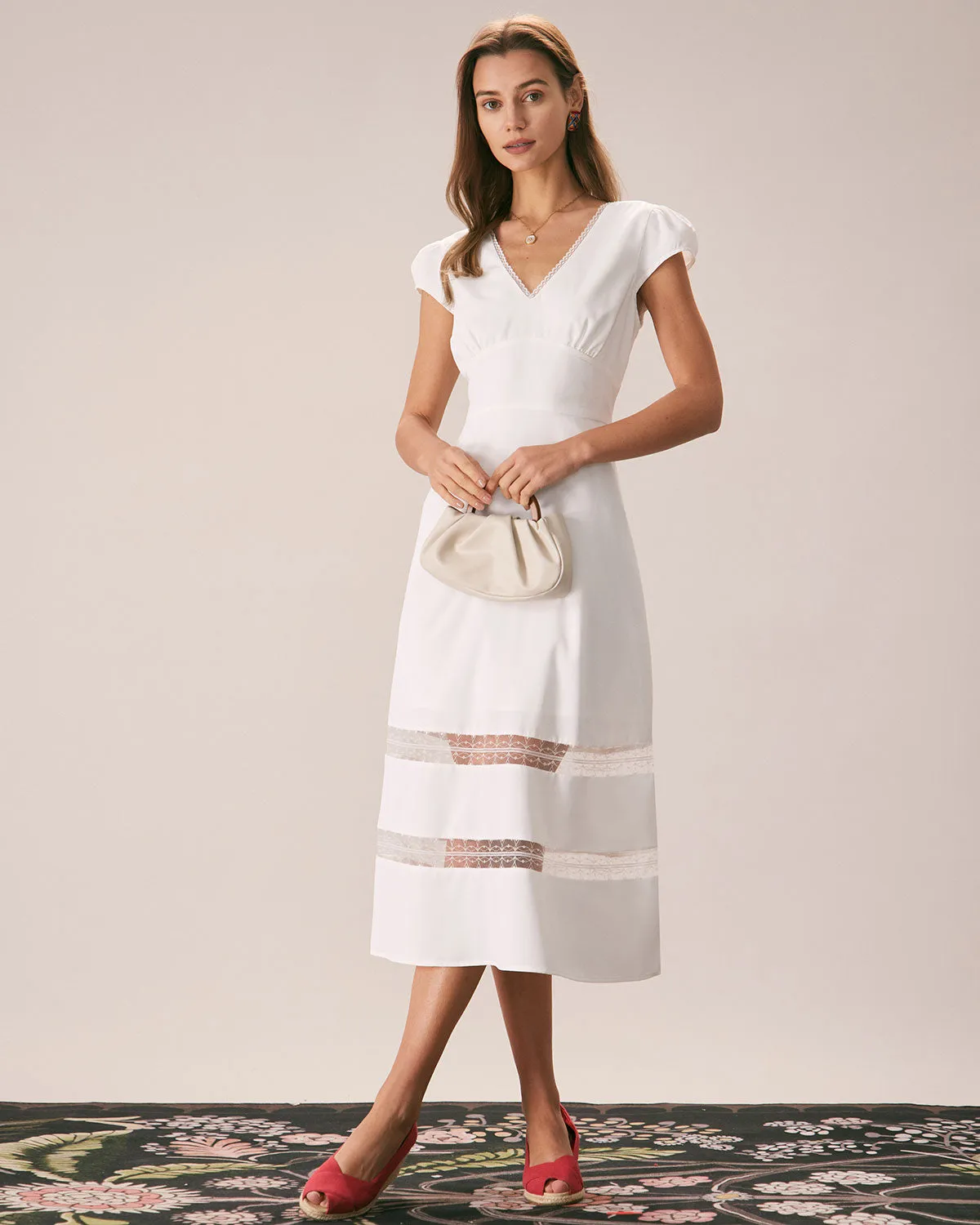 The White V Neck Lace Cap Sleeve Midi Dress sold by rihoas