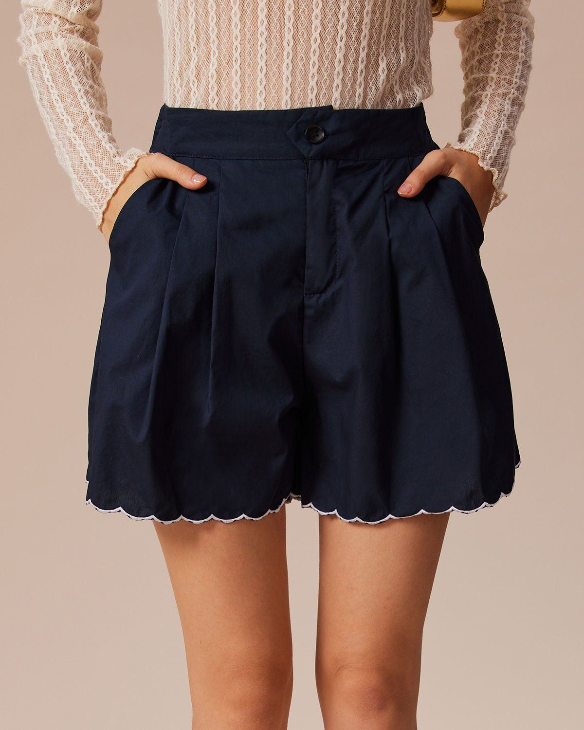 The Navy Embroidery Scalloped Hem Shorts sold by rihoas