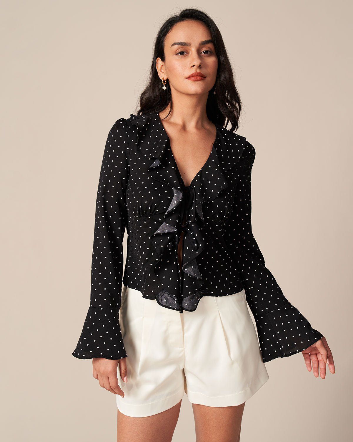 The Black V Neck Polka Dot Ruffle Blouse sold by rihoas