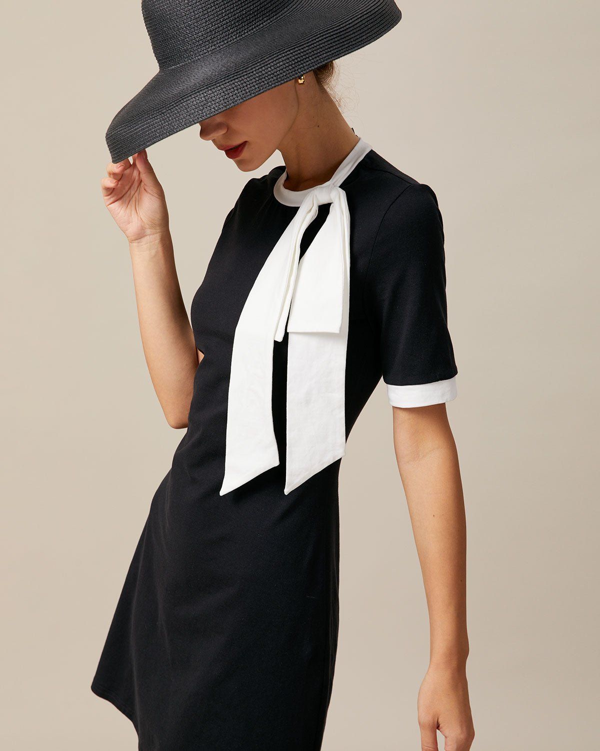 The Black Round Neck Bowknot Mini Dress sold by rihoas product image thumbnail 3