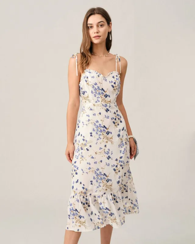 The Ruffle Hem Tie Strap Floral Midi Dress sold by rihoas