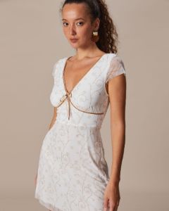 The White V Neck Floral Contrasting Mini Dress sold by rihoas
