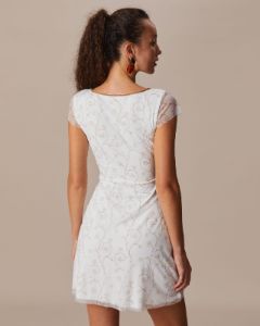 The White V Neck Floral Contrasting Mini Dress sold by rihoas