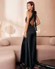 The Black Halter Bowknot Cutout Maxi Dress sold by rihoas