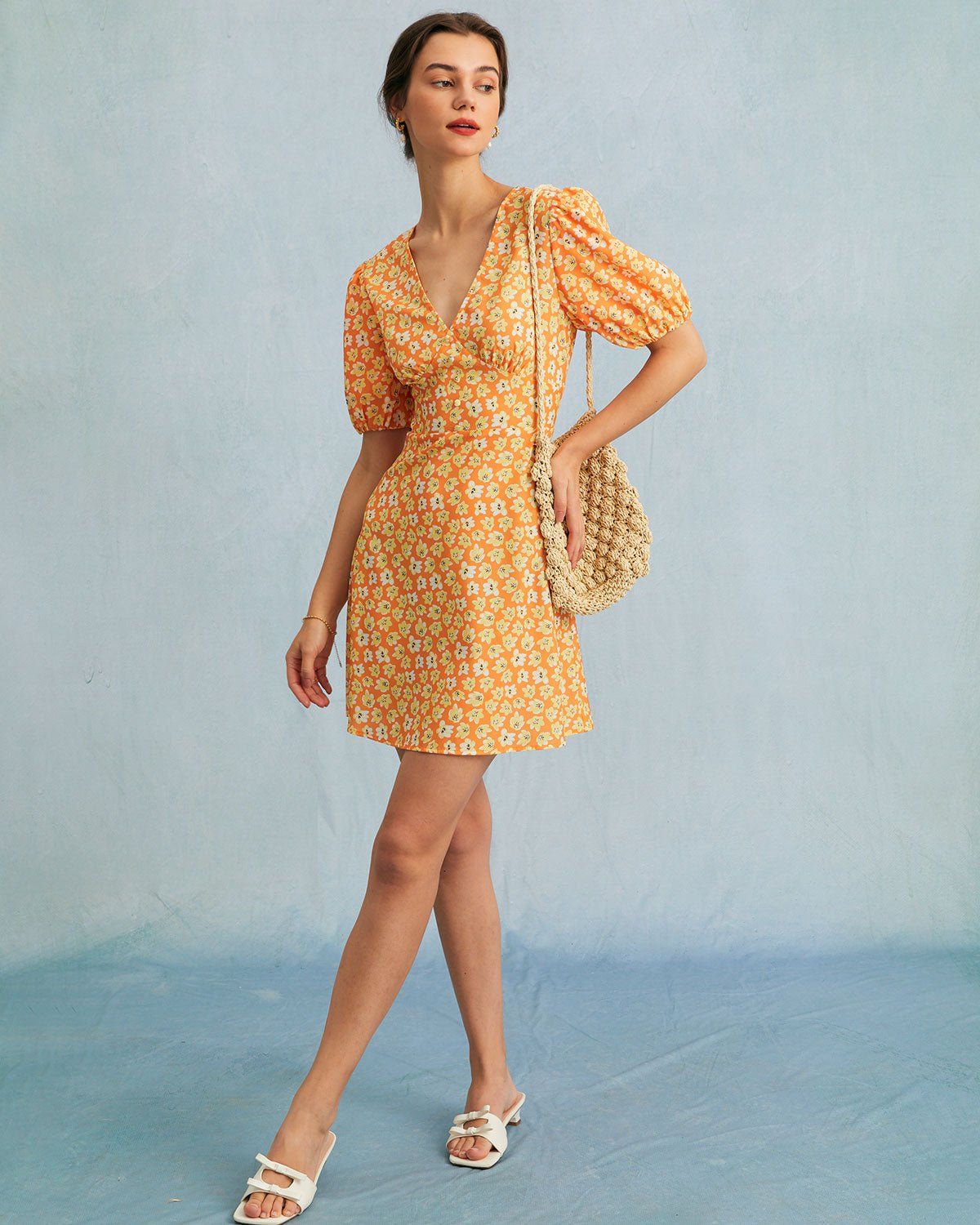 The Orange V Neck Floral Puff Sleeve Mini Dress sold by rihoas