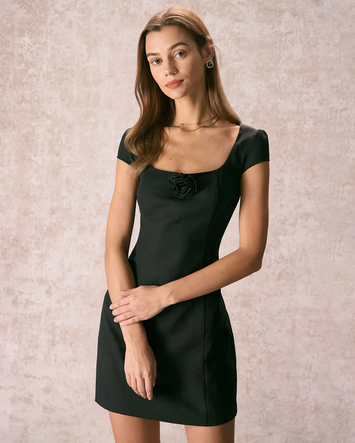 The Black Square Neck Rosette Mini Dress sold by rihoas