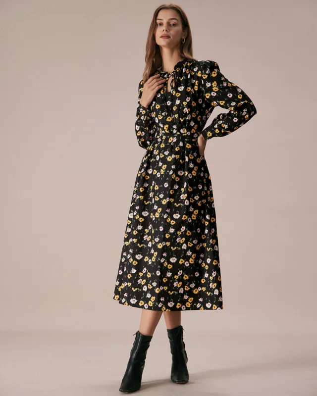 The Black Tie Neck Floral Ruched Midi Dress sold by rihoas
