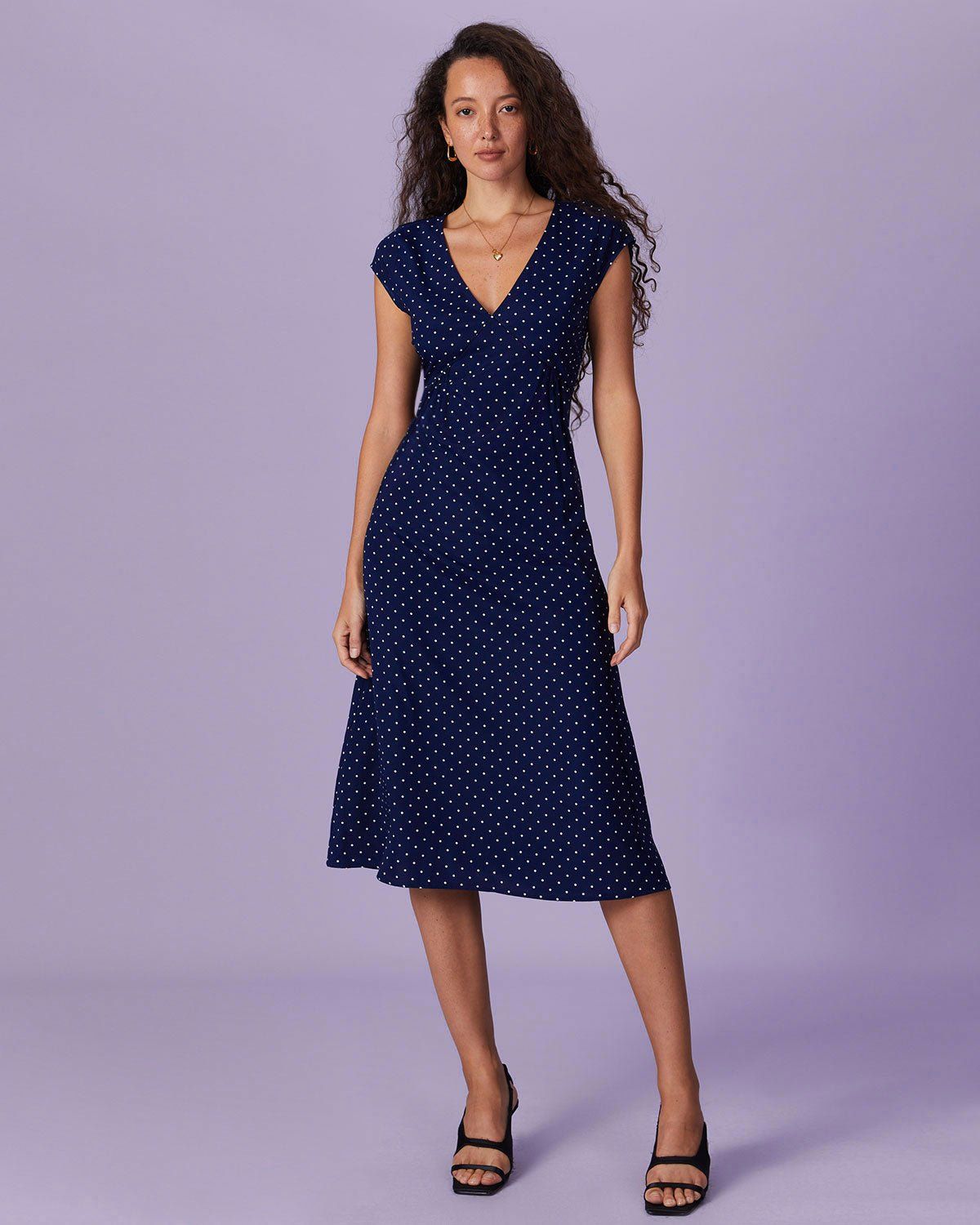 The Navy V Neck Polka Dot Ruched Midi Dress sold by rihoas