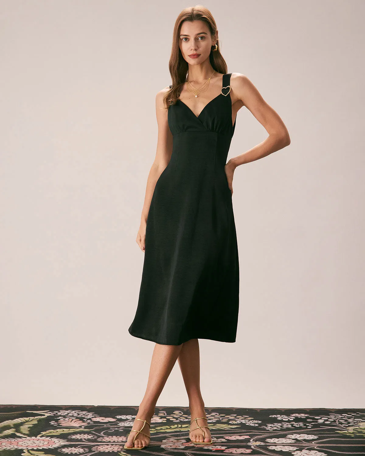 The Black V Neck Ruched Satin Midi Dress sold by rihoas