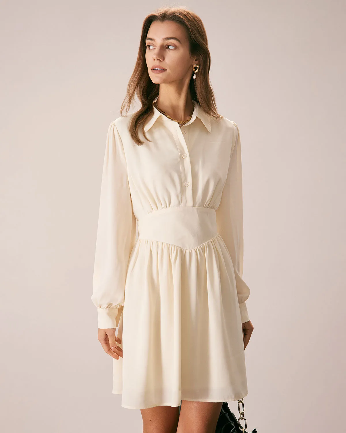 The Beige Lapel Pleated Button Mini Dress sold by rihoas