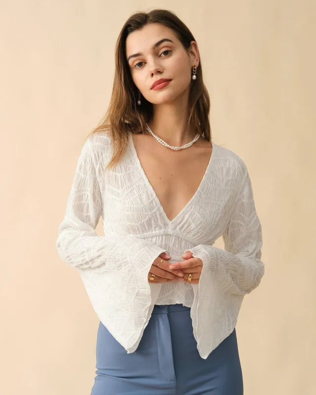 The Solid V Neck Textured Blouse sold by rihoas
