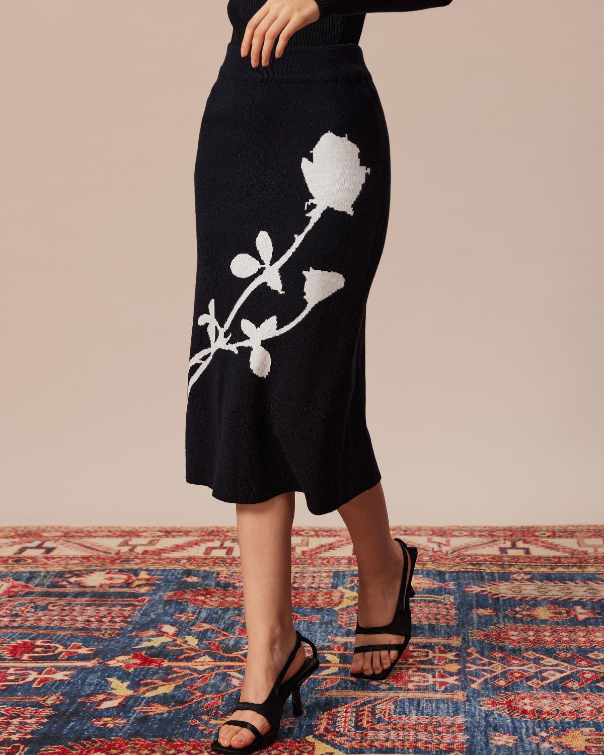 The Black High Waisted Floral Knit Midi Skirt sold by rihoas