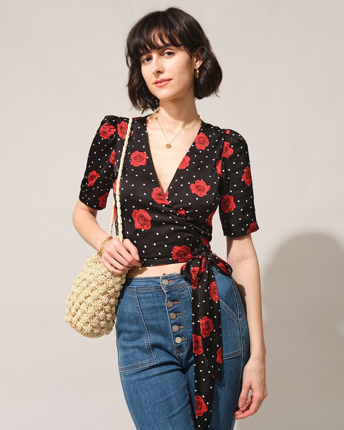 The Black V Neck Floral Wrap Blouse sold by rihoas