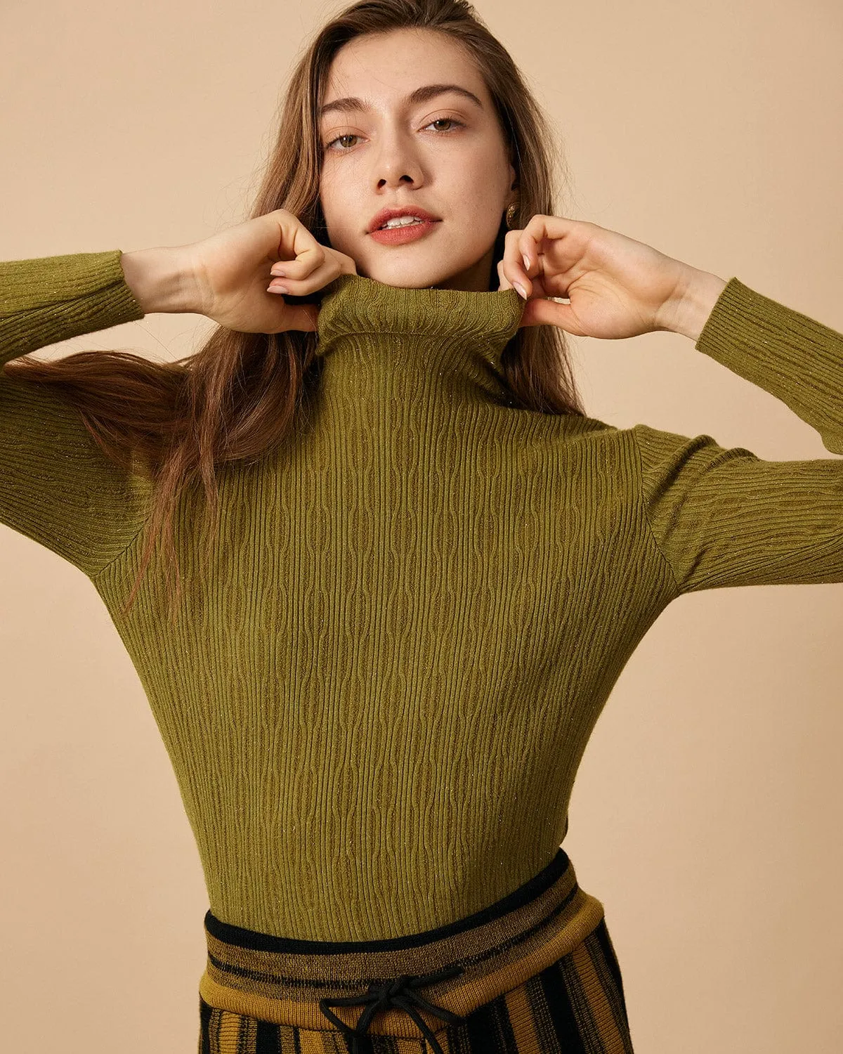 The Solid Textured Turtleneck Knit Top sold by rihoas