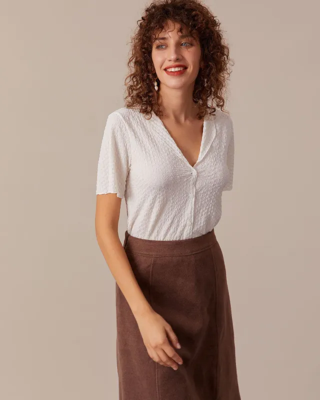 The Apricot V Neck Textured Button Blouse sold by rihoas