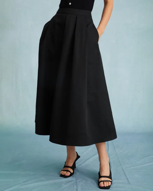 The Black High Waisted Pleated Midi Skirt sold by rihoas